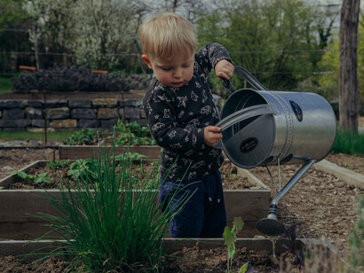 A child learning the importance of growing plants