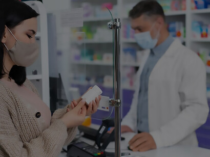 A helpful pharmacist providing prescribed medication to a patient in need