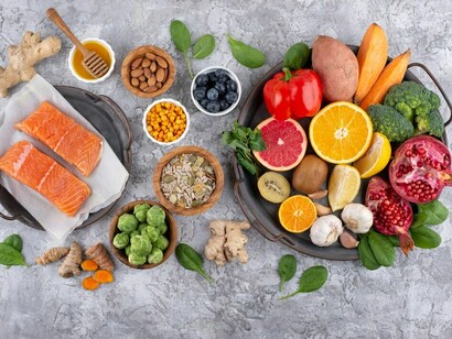A bird’s-eye view showcasing a variety of immunity-boosting foods, from nutrient-packed vegetables and fish to functional foods like probiotics and brain-boosting nutrients