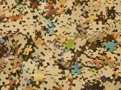 A puzzle with scattered pieces, symbolizing how chaos can lead to creative breakthroughs and new perspectives...when we put the pieces together