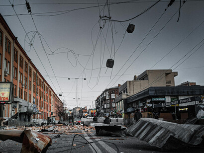 Destroyed city street filled with rubble and debris