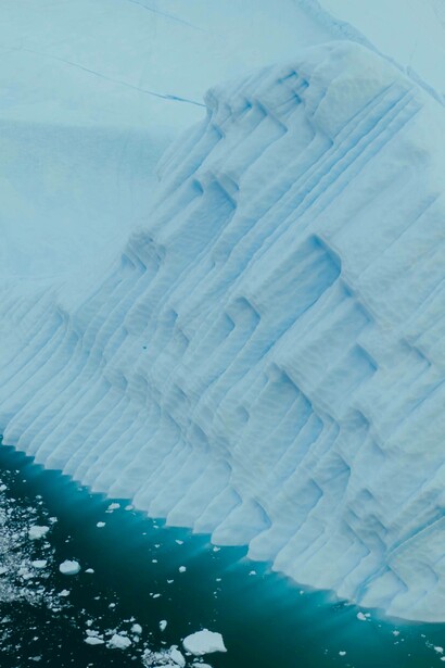 Ice breaking off an iceberg
