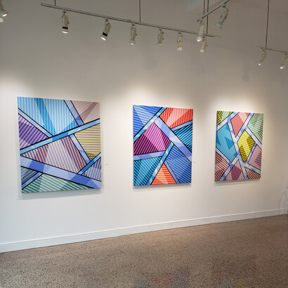 Another view of the gallery showcasing Mark Travers' work, A New Land