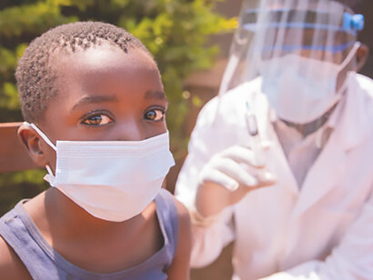 Discover an open-air COVID-19 vaccination session in an African village, highlighting community resilience and proactive pandemic response