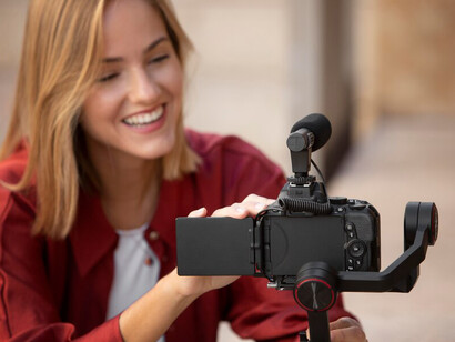 A woman recording content for media, highlighting the impact of women in media and their efforts to challenge stereotypes in films