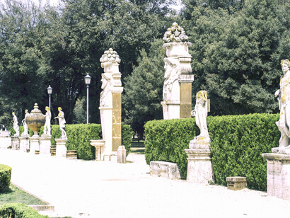 Statues line the road in the gardens of Villa Borghese Park, Rome, Italy