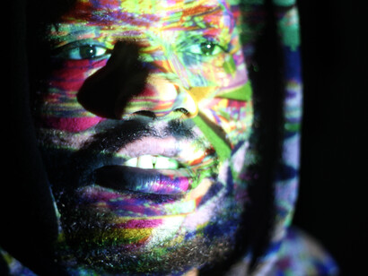 A surreal self-portrait rendered through glitch projection and mirror reflections, symbolizing the distorted echoes of the digital world