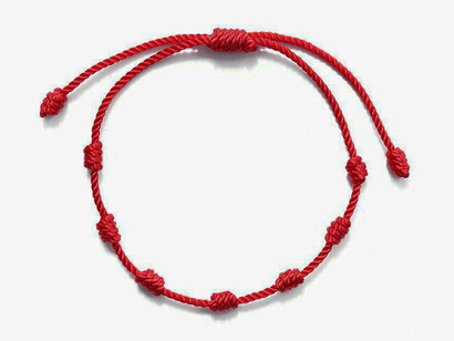 Red thread around the baby’s wrist will help to deter evil energy