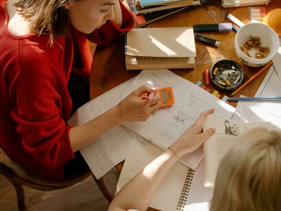A close-up of students studying, representing that learning and excellence aren't always digital