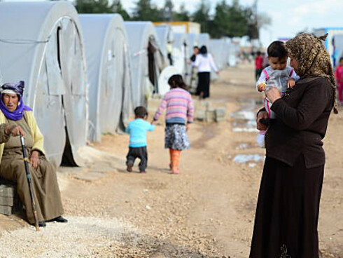 War-displaced Syrian families in a refugee camp, coping with the harsh realities of survival and uncertaint