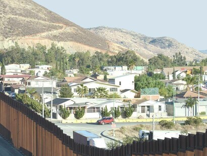 Country divided by borders, example of Mexico and USA