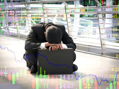 A disheartened businessman faces a plunging stock market—an image of economic crisis, global financial upheaval, and underlying corruption