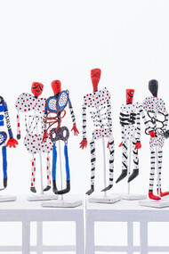 Paper skeleton sculptures on metal stands for the exhibition of Mirades de Murjeres 