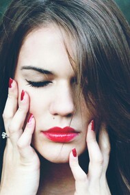 A woman who is an introvert is closing her eyes and concentrating