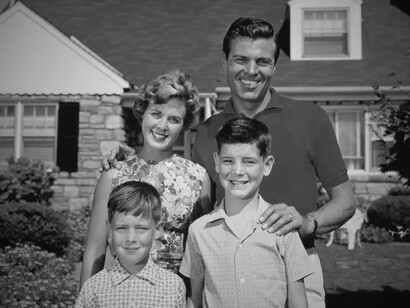 Behind the smiles and manicured lawns lies the postwar fantasy that advertising sold as freedom—but rooted in authoritarian ideals