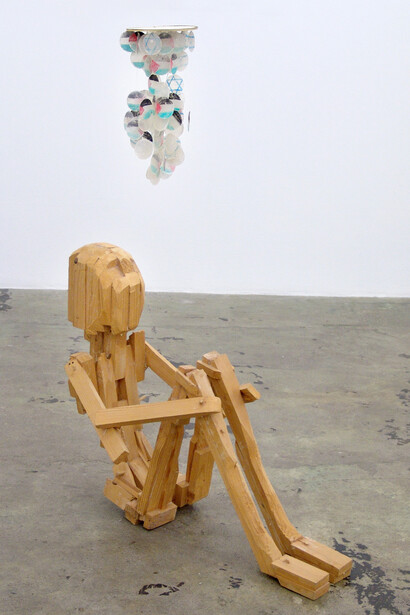 Roza El-Hassan, "Two Buddhists Visiting Hagar" 2004. Wooden sculpture and shell chime, 45 x 34 x 17.5 in. Courtesy the artist and Thomas Erben Gallery, New York.