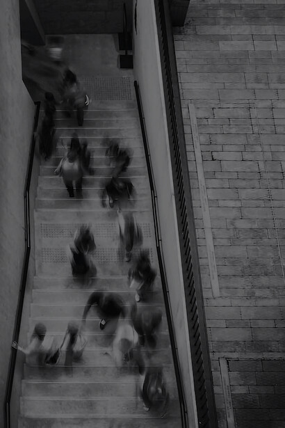 Dynamic shot of people in Hong Kong flowing through a doorway
