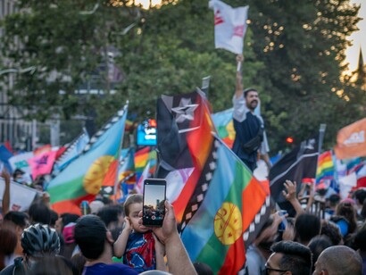 Supporters waving the Mapuche flag during a rally in Santiago, Chile