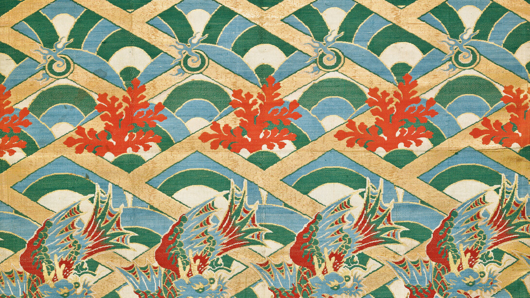 Nishiki. Rows of winged dragons, coral branches, and flaming jewels, set on a ground of stylized waves and a gold cypress-fence lattice. Silk, lampas, twill ground; flat gold thread. End of Edo period, inscription dated 1843. CB-TJ-1927-40 © Copyright Baur Foundation, Geneva (Switzerland)


