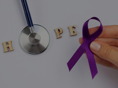 Hands tenderly grasp a purple ribbon, entwined with a stethoscope