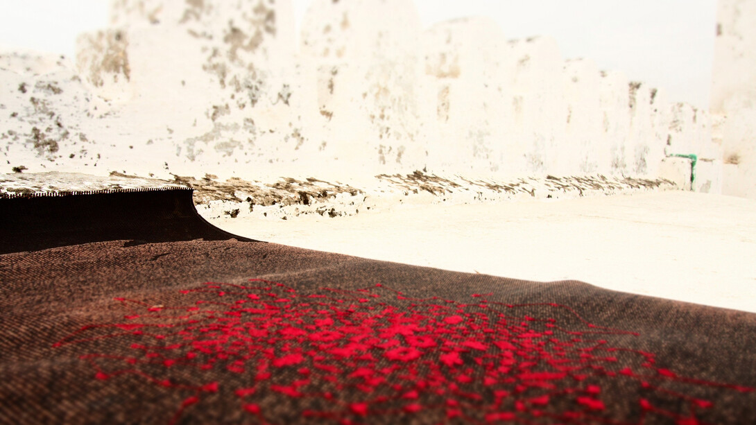 Sara Ouhaddou, Recycled rubberized cloth and silk embroidery