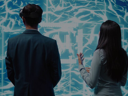 Man and woman viewing an AI hologram with a focus on ethical considerations and the role of individuals as active co-creators of their reality