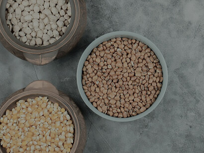 Assorted uncooked dals artfully presented on a marble surface, exhibiting a variety of raw dal compositions