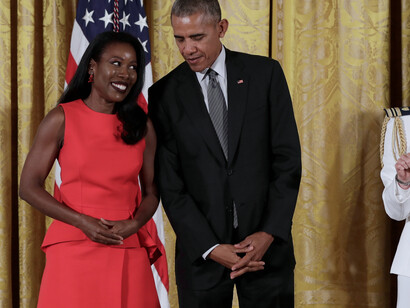 Isabel Wilkerson, the author, standing with then-President, Barak Obama