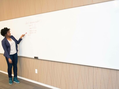 A woman teaching definitions of words overseas