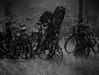 Heavy rain is making all the pedestrian bicycles soaked in the Netherlands