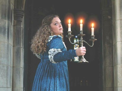 Princess Isabella running away holding a candlestcik in the Castle of Otranto 