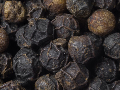 Close up of black pepper (piper nigrum) corns, showing the veiny exterior