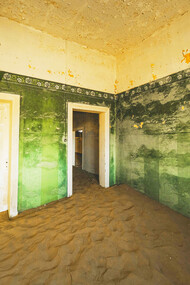 Doorways through time in an abandoned house in Kolmanskop, Namibia, photographed by Francesco Ungaro