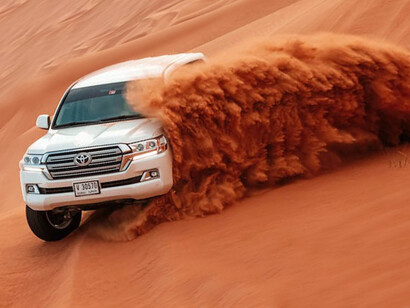 Engage in a thrilling desert safari experience in Dubai, United Arab Emirates, as you traverse the sands in robust 4x4 vehicles