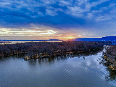 A serene view across Winona Lake, Minnesota beneath the northern sky, symbolising the calm found after emotional storms
