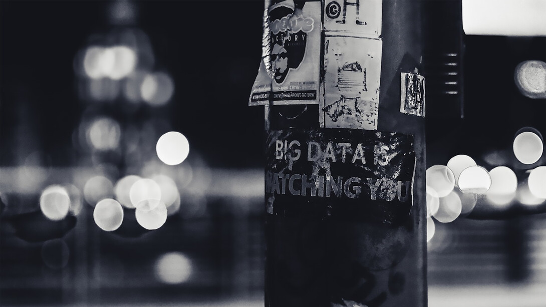 A pole covered in stickers serves as a stark reminder that big data is always watching you