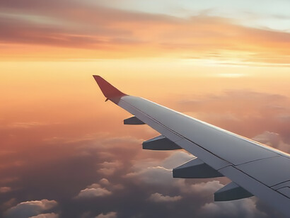 The enchanting spectacle of the sun illuminating the sky as seen from the unique vantage point of an airplane
