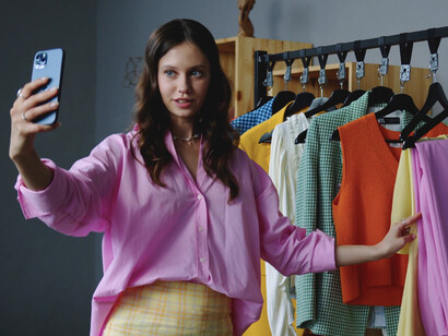 As this influencer browses through the rack, she reflects on how the relentless pace of fashion trends can often overshadow personal style