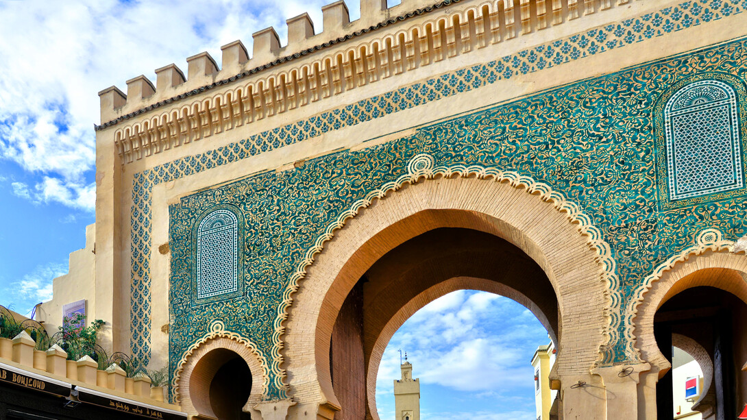 The vibrant blue entrance of Bab Bou Jeloud, symbolising Fez’s enduring artistic and architectural legacy
