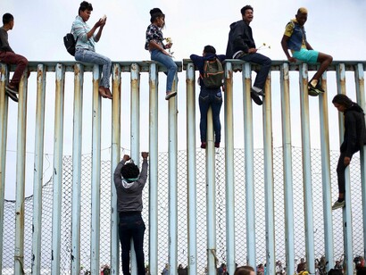 Migrants trying to cross border fences
