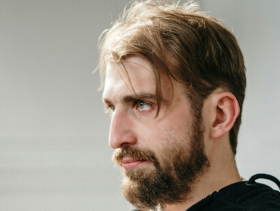 A downtrodden man, staring into nothing