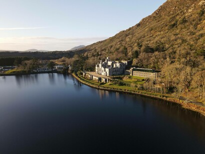 Castle at the foot of a mountain by the lake, Ireland