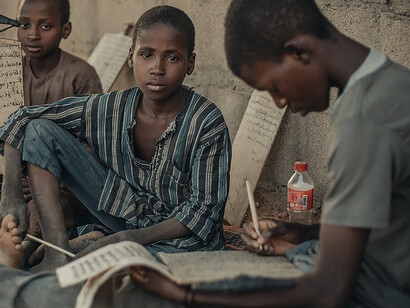 Almajiri boys attending a Quranic school, where they are taught religious teachings and basic education, Nigeria