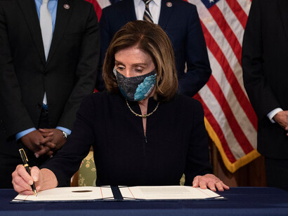 Pelosi signs article of impeachment against Trump
