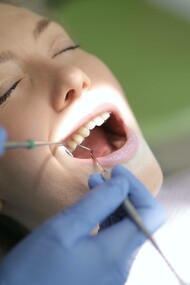 Patient having her teeth examined