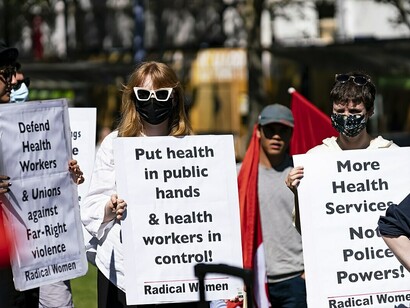 Protest for public health reforms and workplace safety standards in Australia, with demonstrators calling for improved policies and protections