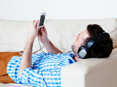 Man streaming music from his phone