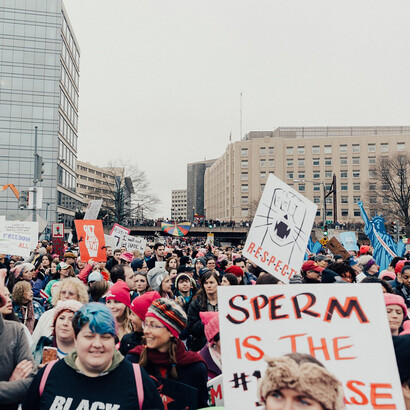 Crowd of men and women during a feminist march