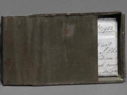 Freedom papers and handmade tin carrying box belonging to Joseph Trammell, 1852. Gift of Elaine E. Thompson