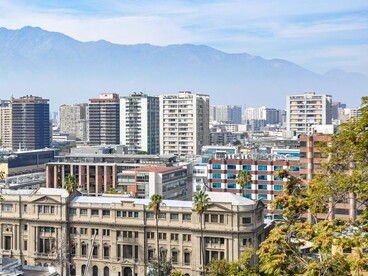 The modern skyline of Santiago, Chile, with Andes visible in the background, reflecting the transformation of a city marked by a turbulent past